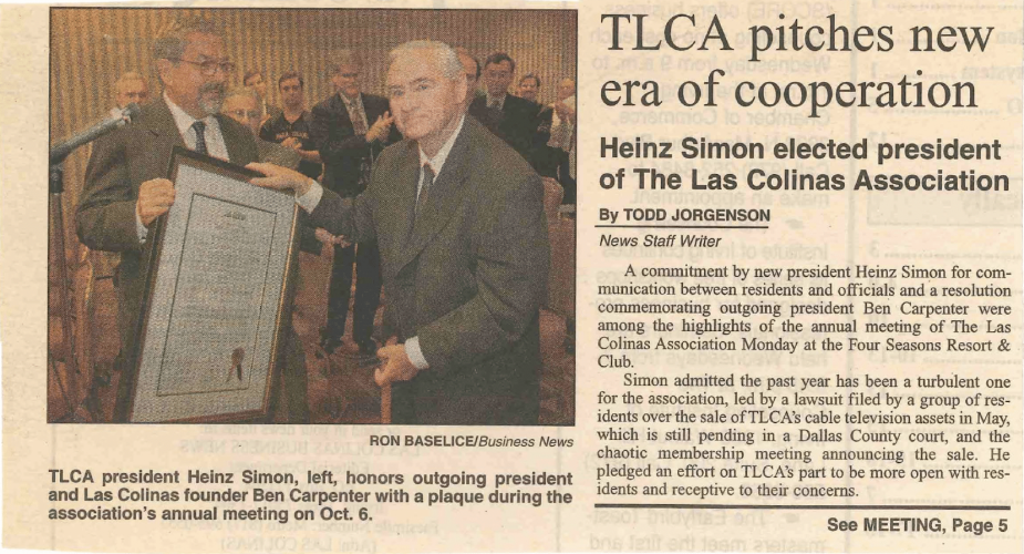 Newspaper clipping from the October 13, 1997 edition of Las Colinas Business News newspaper. Heinz Simon (left)  honors outgoing president and Las Colinas founder Ben Carpenter (right) with a plaque during the association's annual meeting.